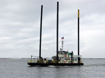 What is a spud barge?