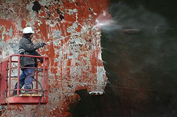 Man cleaning ship